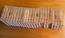 RED BUCKRAM CLOTH HARD COVER 'PUNCH LIBRARY OF HUMOUR' - 24 VOLUMES  C 1920S 