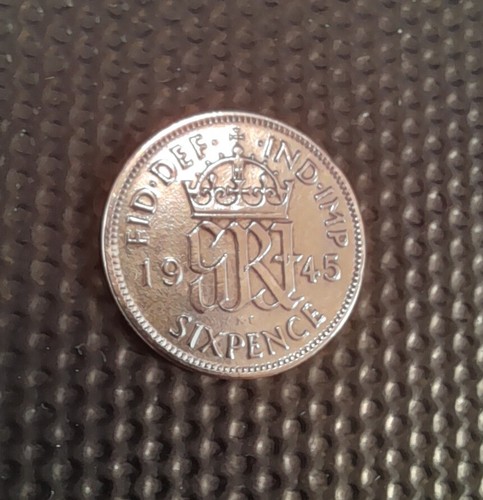 Polished silver sixpence - polished,