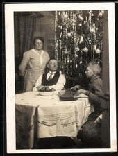 Photograph Christmas, boy playing the zither under the Christmas tree 