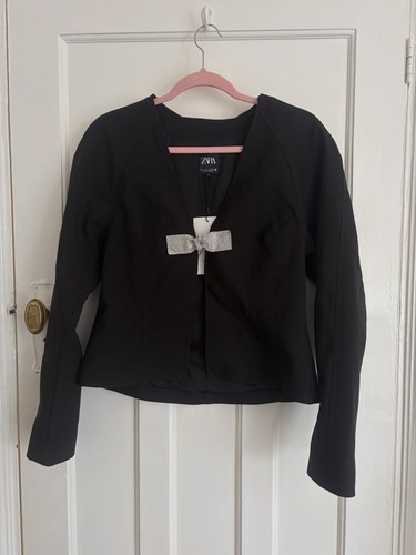Black long sleeve sparkly bow - sleeve,