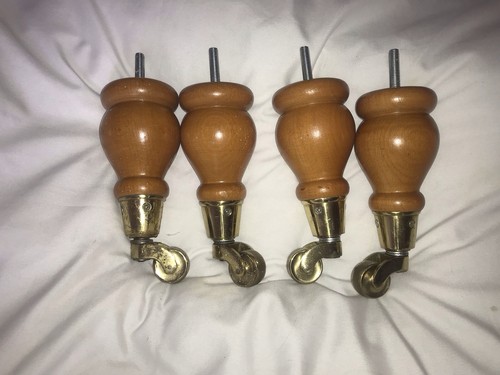 Turned wood brass castor - turned,