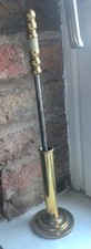 Vintage brass poker in stand
