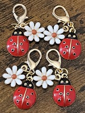 4 daisy flower and ladybird