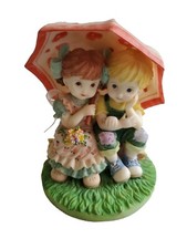 Boy & Girl Under Umbrella