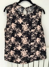 ladies slv.less tunic top