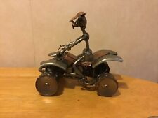 scrap metal art sculpture quad bike rider