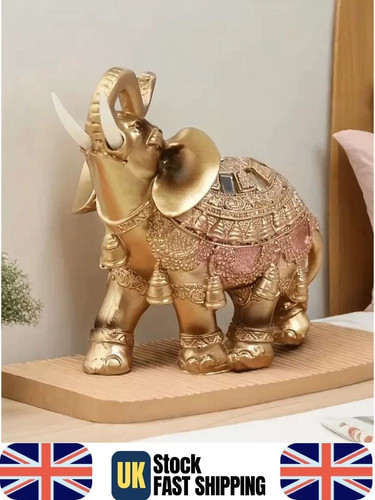Large gold elephant statue - gold,
