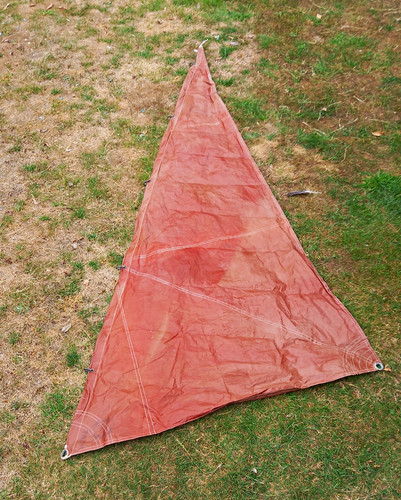 Tan triangular jib - triangular, sail