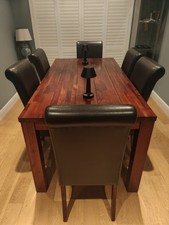 Dark solid wood dining table and 6 chairs