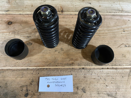 Pair seat compression - of,
