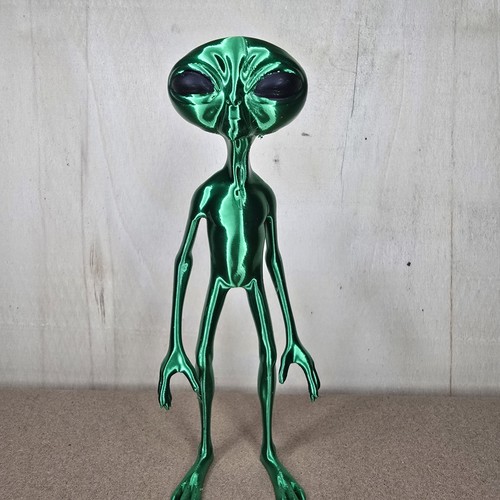 Green alien figurine model - alien,