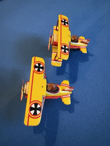 Pair vintage tin litho biplane - pair,