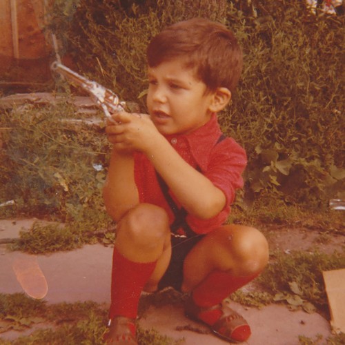 Young boy playing - cowboy, with