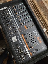 Yamaha EMX 620 powered sound mixer, compact unit, black carpet covered.