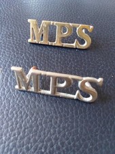 A Pair of white metal Military