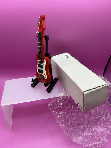 Red miniature electric guitar - electric,
