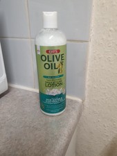 ORS™ Olive Oil Max Moisture Moisturizing Daily Styling Lotion *One drop applied*