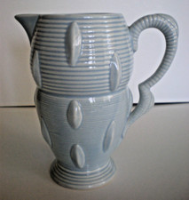 Vintage Art Deco-Style Falcon Ware Pale Blue Ceramic Jug with Textured Surface.