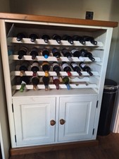 Country Style 28  Bottle Wine Rack With Cupboard, oak Top And Plinth .