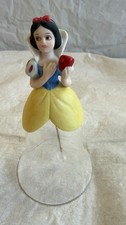 A BELL OF SNOW WHITE MADE OF