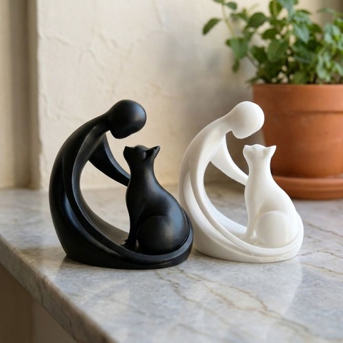 Human and cat statue - and, hugging
