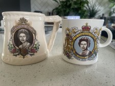 2 mugs commemorating silver