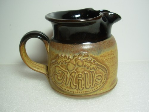 Large pottery milk jug - large,