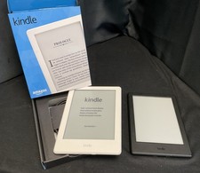 2 X Amazon Kindle, One Black, No Box And One White, Boxed With Charger.