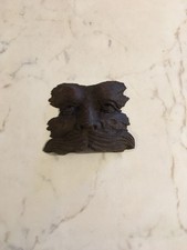 AN EXTRAORDINARY PIECE OF HAND CARVED TREEN A FACE RISING OUT OF STILL WATER