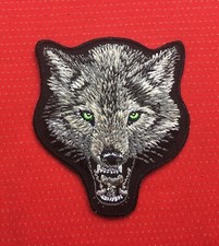 WOLF HEAD BLACK DOG BADGE