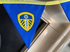 LEEDS UNITED PENNANT'S A ROW OF 6 FLAGS 15CM X 18CM.FABRIC FULLY LINED.