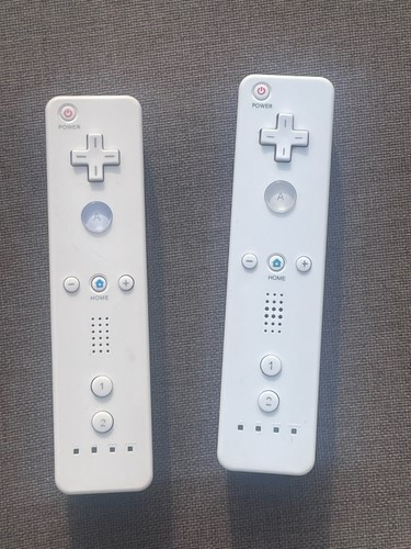 White wii remote controllers - 2,