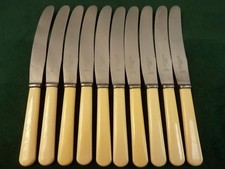 10 nice Vintage Baines Cattell Dinner Table Knives ivory coloured resin handles
