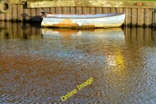 Photo 6x4 Small boat reflected