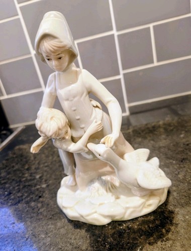 Vintage porcelain boy and - boy, girl