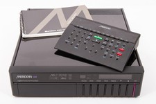 Meridian 568 Digital Surround Processor in black, with remote