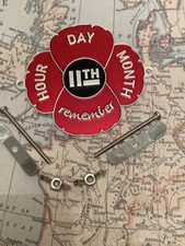 Red poppy grille car badge - red,