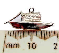 antique silver charm of an