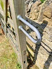 Double leg gate striker wooden