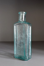 Boots Cash Chemists bottle in aqua glass, curved shoulders late C19th
