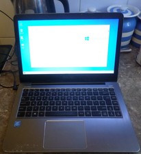 ASUS E403S Laptop - Powers On - Listed For Spares Or Repair.
