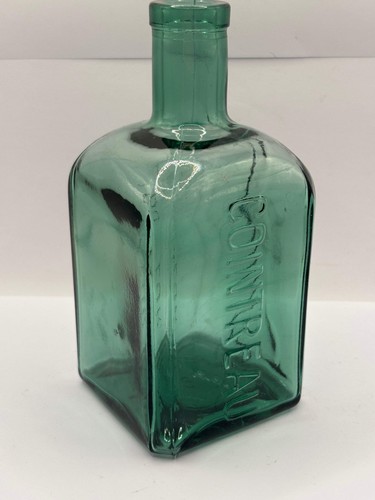 Old green liqueur bottle