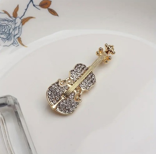 Crystal studded brooch musical - studded,