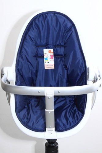 The brown cover for - , highchair