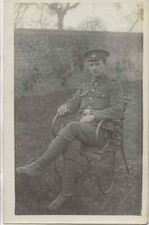 Military, Lance Corporal RAMC, seated in garden, photo postcard Burrell Fornham