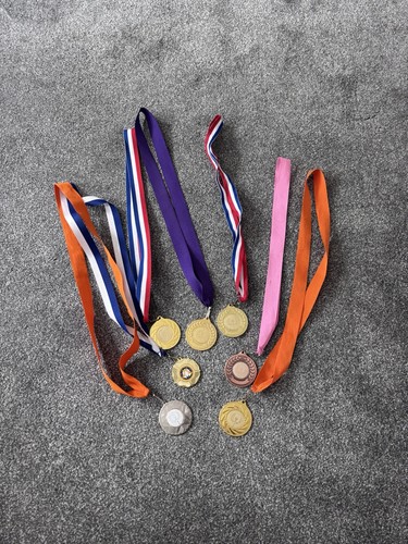 Assorted metal medals - metal,