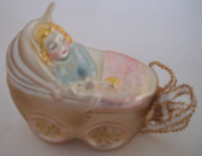 Baby boy in carriage pram