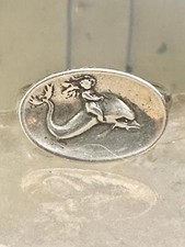 Lady riding on dolphin band