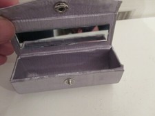 Silver satin lipstick holder