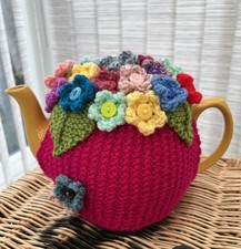 Hand Knitted Bright Pink Tea Cosy With Flowers. Fits Medium Size Teapot